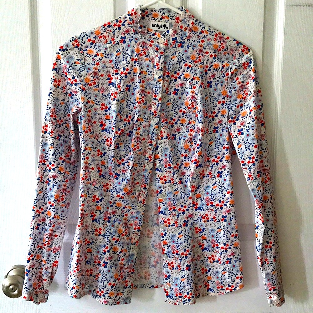 Fully tailored, button-down shirt designed to fit larger bust